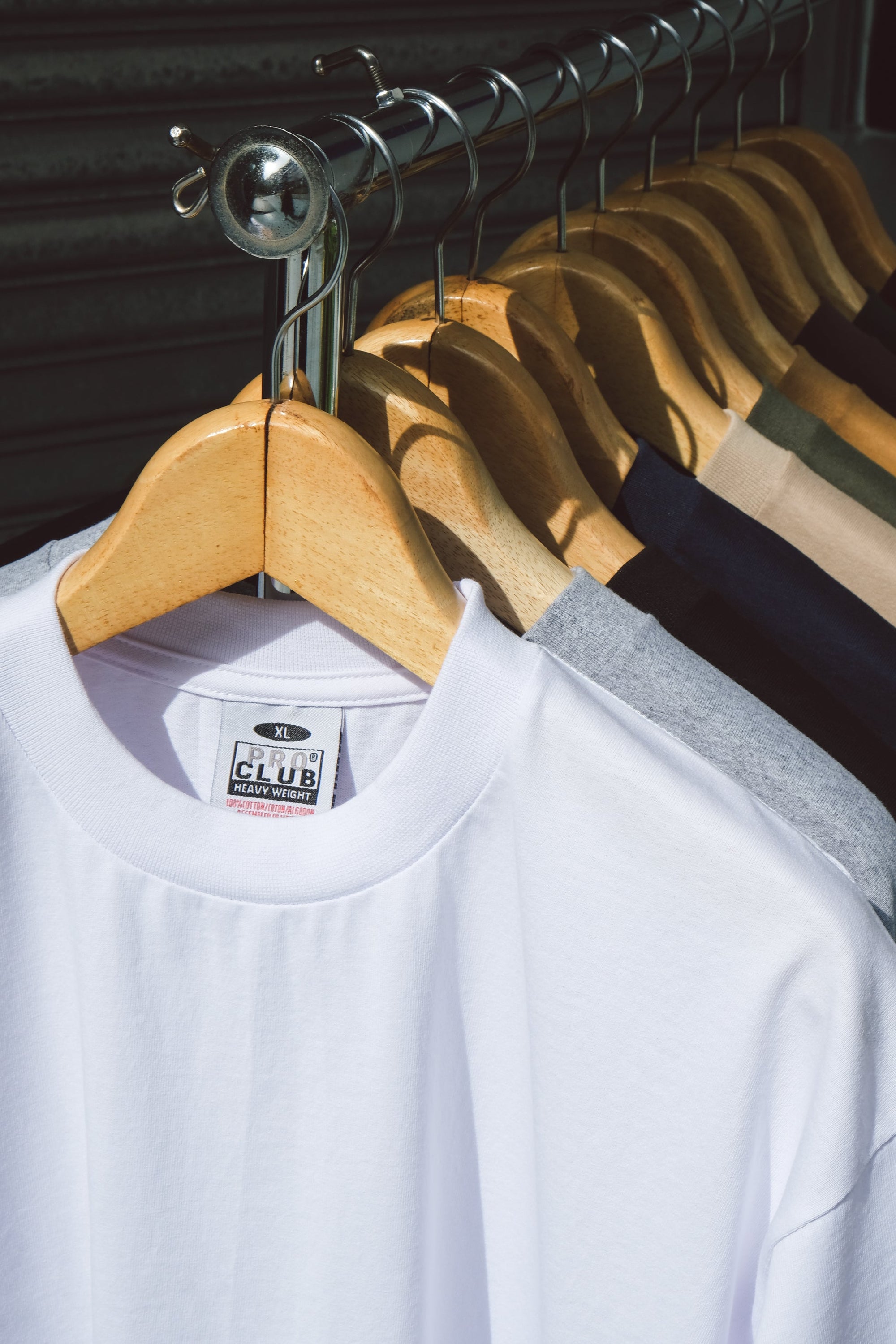 PROCLUB heavyweight cotton t-shirt white XL tag close-up on hanger – premium blank streetwear Singapore